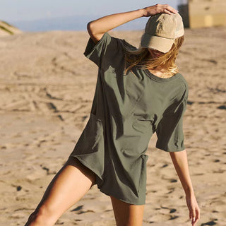 Woman's casual backless beach jumpsuit with pockets on sandy desert terrain