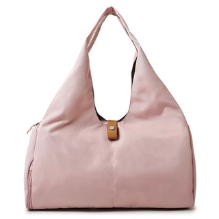 Stylish pink women's duffle bag with shoe compartment, versatile sports and travel accessory