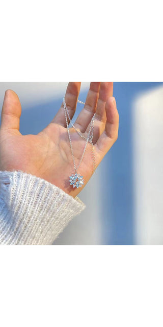 Sparkling Snowflake Necklace: Rhinestone-encrusted pendant in a delicate snowflake design, suspended on a fine silver chain, showcasing feminine elegance and winter charm.
