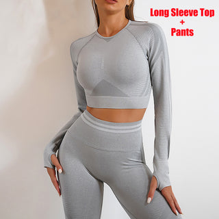 Stylish seamless grey activewear set featuring a long sleeve top and matching high-waisted leggings from the K-AROLE™️ collection, showcasing a form-flattering, comfortable, and versatile workout outfit.