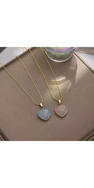 Elegant moonstone necklaces on sleek gold chains, perfect accessories for the modern, stylish woman.