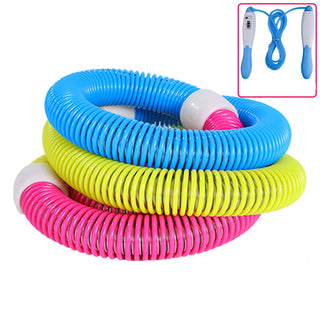 Colorful plastic spring-coil exercise hoop fitness equipment, with a jump rope shown in the inset image. The hoops come in various bright colors including blue, yellow, and pink, designed for weight loss, home workout, and bodybuilding activities.