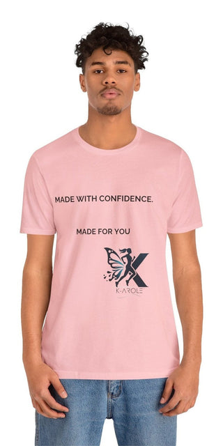 Unisex pink jersey short sleeve t-shirt with "Made with Confidence. Made for You" text and a stylized 'X' graphic design.