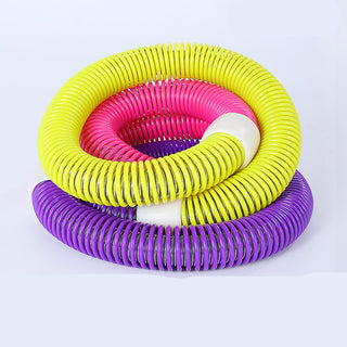 Colorful fitness hoops in vibrant yellow, pink, and purple tones stacked against a plain white background. These soft, flexible hoops are used for sports, exercise, and fitness training.
