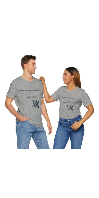 Unisex jersey short sleeve t-shirts with printed graphic design featuring a butterfly icon. The model image shows a male and female pair wearing the casual, comfortable t-shirts in a grey color.