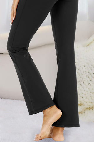 Stylish olive green flared yoga pants with comfortable fit and versatile design.