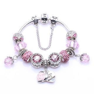 Elegant silver-tone charm bracelet with pink crystal-encrusted beads and a dangling heart-shaped charm for Mother's Day gift.