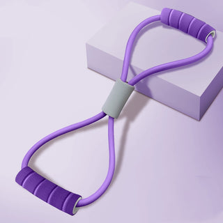 Lightweight purple resistance exercise band on white cube backdrop