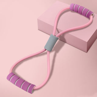 Pink and purple exercise resistance bands on a pink background with a geometric shape.