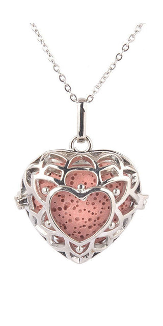 Elegant silver-toned aromatherapy diffuser necklace with intricate heart-shaped pendant design, perfect for infusing calming fragrances throughout the day.
