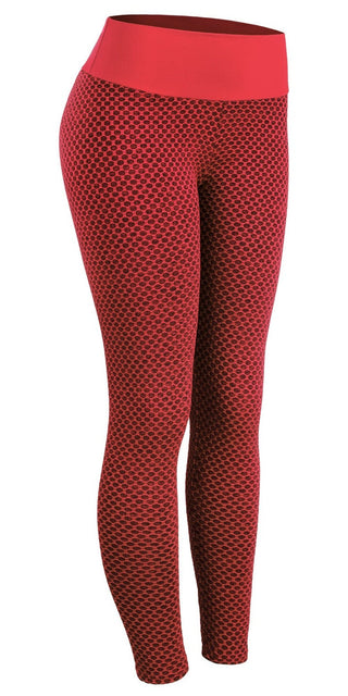 Stylish red leggings with a polka dot pattern, designed for active women. These breathable, high-waisted yoga pants feature a comfortable, seamless construction to support your fitness and workout routines.