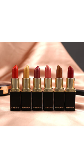 Metallic lipstick collection with temperature-changing shades and a shiny gilt finish, showcased on a reflective surface.