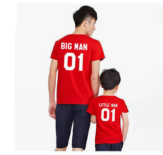 Matching family t-shirts: Big Man 01 and Little Man 01 in red, worn by a father and child showing coordinating outfits.