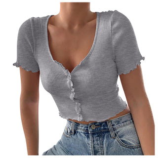 Stylish ribbed grey short-sleeved crop top with ruffled details, worn with high-waisted denim jeans against a plain background.