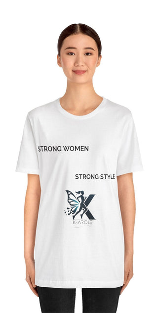 Stylish white t-shirt with "Strong Women, Strong Style" graphic design, modeled by a smiling young woman against a plain background.