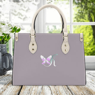 Gray Luxury Women's PU Handbag with Butterfly Logo
This image shows a chic, gray handbag from the K-AROLE fashion brand. The spacious tote features a stylish butterfly logo design and elegant leather-like handles, making it a sophisticated accessory for any outfit.