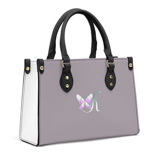 Luxury Women's PU Handbag with Butterfly Logo
This stylish and versatile handbag features a sleek gray and white design with a butterfly logo, providing a modern and fashionable accessory for women.