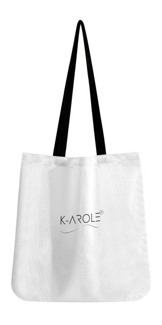 Stylish white tote bag with black handles and K-AROLE logo, showcasing a versatile and fashionable accessory for women.