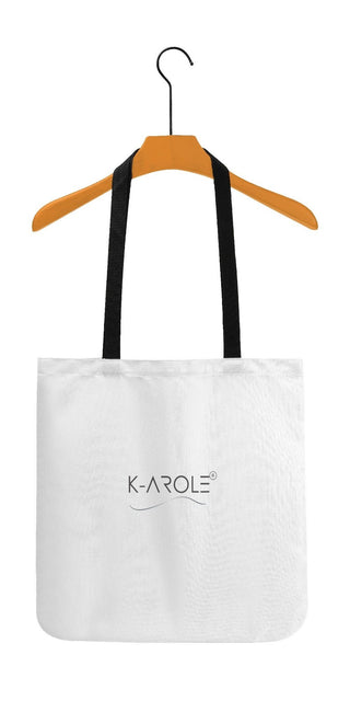 Chic Women's White Tote Bag - Stylish and practical K-AROLE handbag displayed on an orange wooden hanger, featuring the K-AROLE logo prominently showcased.