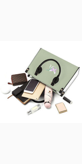 Stylish green cosmetic bag with various makeup products, including lipstick, eyeshadow palette, and headphones, on a white background.
