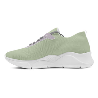 Stylish and breathable women's mesh sneakers in a light green color with a chunky sole. The sneakers feature a sock-like knit upper for a comfortable and flexible fit, designed for active lifestyles. The chunky, textured sole provides stability and traction. These trendy sneakers from the K-AROLE brand are perfect for conquering every season with both style and comfort.