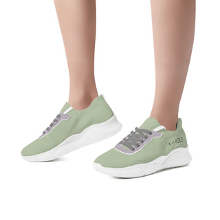 Breathable mesh sneakers in a light green color, featuring a chunky and comfortable sole design for versatile wear. The shoes showcase a sporty, modern aesthetic suitable for various active and casual occasions.