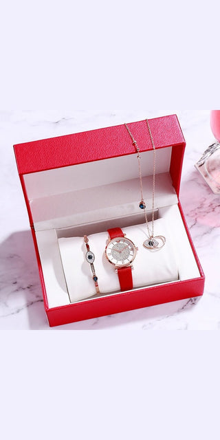 Elegant women's watch set with leather strap, pendant, and earrings in a stylish red gift box. Fashionable accessories for Valentine's Day.