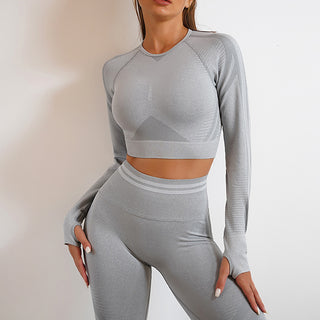 Gray seamless yoga top and leggings outfit with sleek, modern design for an elevated athleisure look.