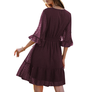 Beautiful burgundy-colored midi dress with flared sleeves and a fit-and-flare silhouette, showcasing intricate lace detailing for an elegant and chic look.