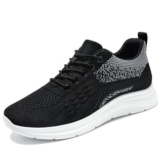 Stylish lace-up sneakers for women featuring a breathable, lightweight mesh upper in a trendy black and white color scheme.