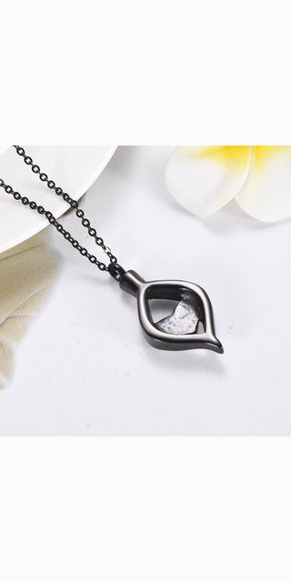 Titanium steel heart-shaped ash box pendant with delicate floral accents, a thoughtful memorial jewelry piece.