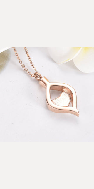 Elegant rose gold heart-shaped ash box pendant with delicate chain, suitable for fashionable women's athleisure outfits.