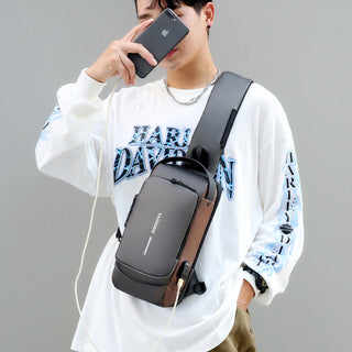Exclusive PU Leather Messenger Bag - Your Stylish Companion, Worn by a fashionable man using smartphone in casual outfit