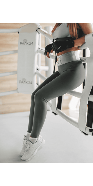 Stylish grey high-waisted yoga pants with comfort and functionality for active wear.