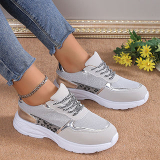 Stylish women's lace-up sneakers with breathable mesh and flat soles. Fashionable casual shoes with a lightweight and sporty design for everyday wear.