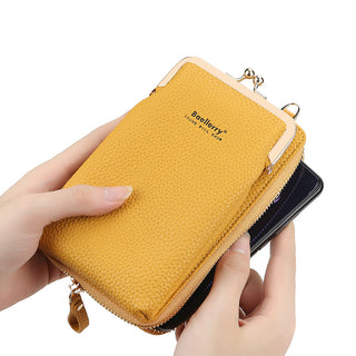 Stylish leather phone wallet in a vibrant yellow color, featuring a lock closure and a detachable strap for convenient carrying. The wallet is held in the hands, showcasing its compact and functional design.