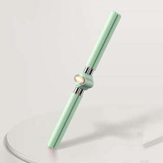 Mint-colored posture correcting yoga stick with metallic details on a plain background