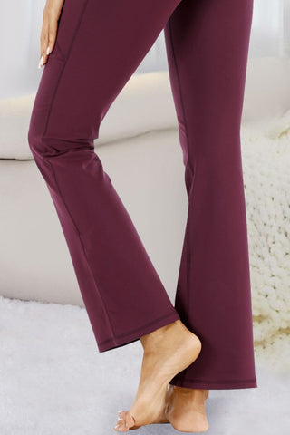 Stylish burgundy flared yoga pants by Trendsi