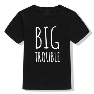 Black t-shirt with the text "BIG TROUBLE" printed in white letters