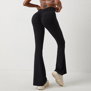 High-waist yoga leggings with flared legs shown in a studio setting against a white background.