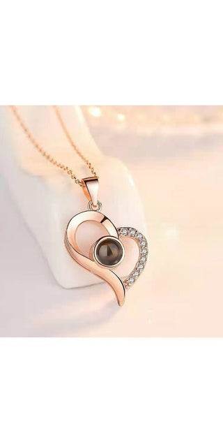 Elegant rose gold heart-shaped necklace with a captivating pearl pendant and sparkling crystals, a stylish accessory to elevate any outfit.