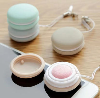Pastel-colored macarons keychain screen cleaner on wooden surface
