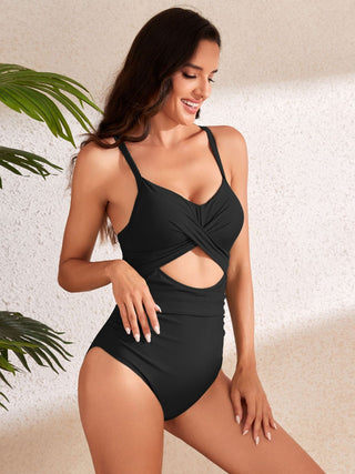 Stylish black swimsuit with cutouts and waist tie by Trendsi