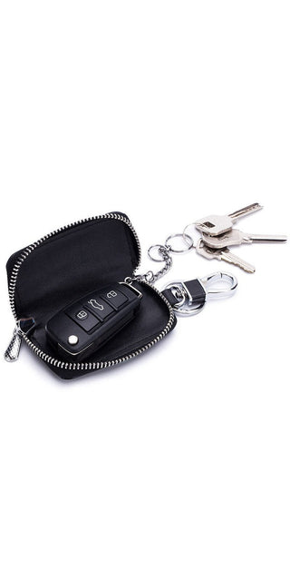 Leather key holder with zipper, featuring a compact design to organize and protect car keys and accessories. Sleek black finish with a metallic keychain for easy access.