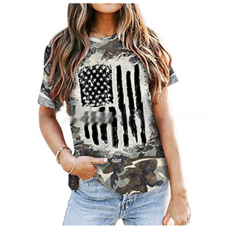 Distressed American flag graphic t-shirt, casual summer fashion item with camouflage design, women's relaxed fit tee with comfortable short sleeves.