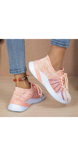 Stylish pink and white sports shoes with lace-up design, breathable mesh material, and patterned accents. Casual sneakers suitable for running, walking, and everyday wear.