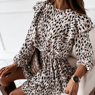Stylish leopard print midi dress with puff sleeves displayed on a female model.