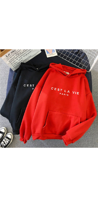 Vibrant red hooded sweatshirt with "C'est la vie Paris" text print, part of a stylish casual sportswear collection displayed on a clothing rack.