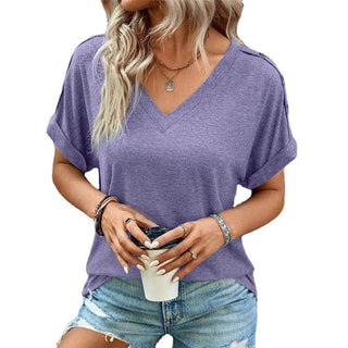 Lavender casual top with v-neck design, worn by a woman with wavy blonde hair