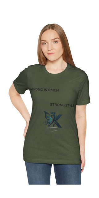 Stylish casual green unisex t-shirt with trendy graphic design featuring strong women empowerment message, worn by a young woman with long brown hair against a plain white background.